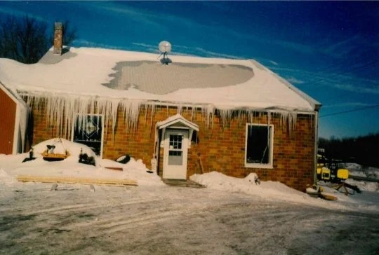 Imaeg showcaing our building draped in snow